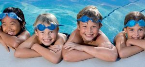 Kids learning to swim in a pool